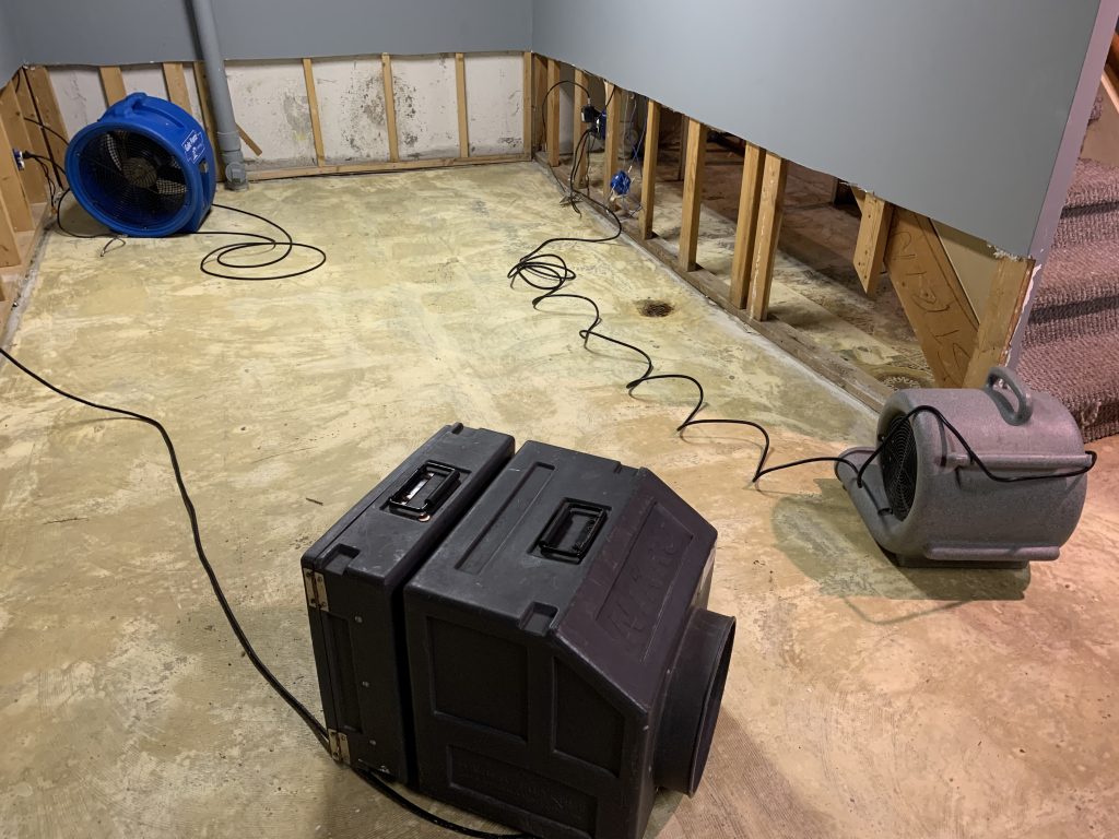 removing wet drywall during flood cleanup